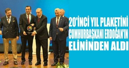PLAKETİNİ CUMHURBAŞKANI ERDOĞAN VERDİ 